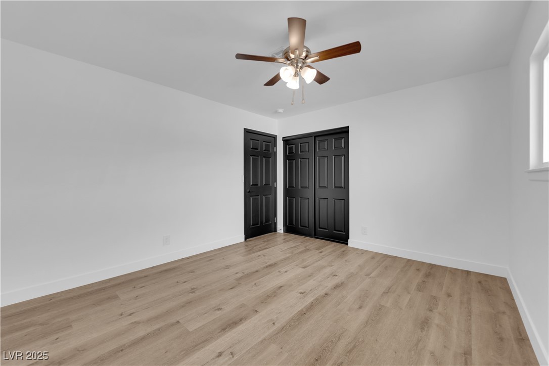 3228 Robin Circle Las Vegas, NV 89121 - Photo 27 of 45 Unfurnished bedroom with a ceiling fan, light wood