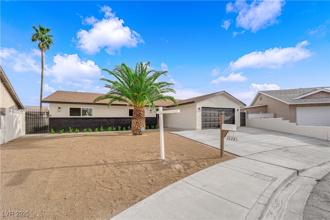 3228 Robin Circle Las Vegas, NV 89121 - Photo 3 of 45 Single story home featuring stucco siding, a gate,