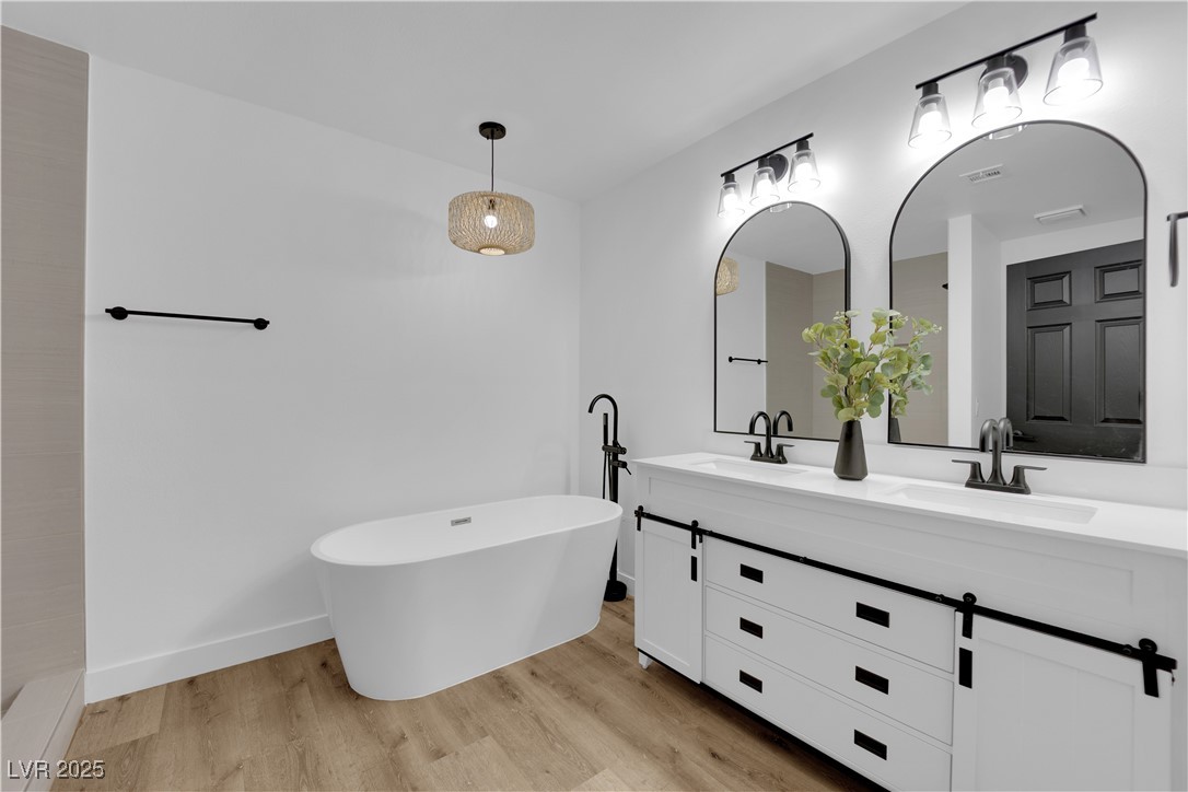 3228 Robin Circle Las Vegas, NV 89121 - Photo 33 of 45 Full bath with double vanity, a freestanding bath,