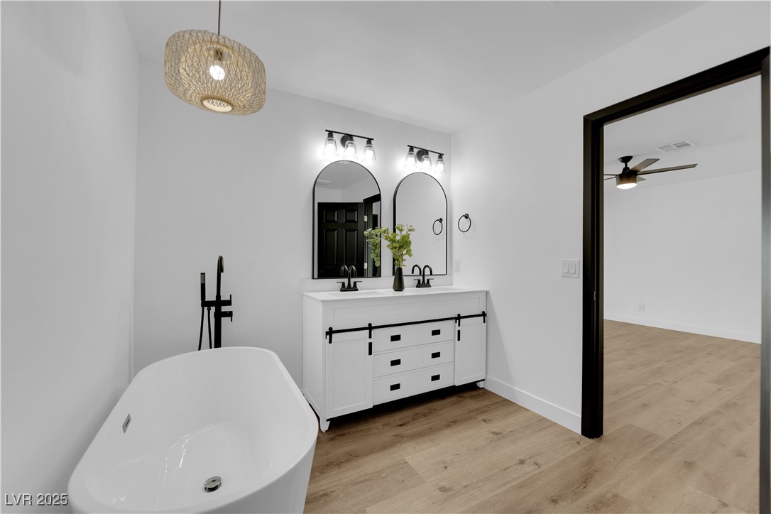 3228 Robin Circle Las Vegas, NV 89121 - Photo 34 of 45 Bathroom with a sink, wood finished floors, and do