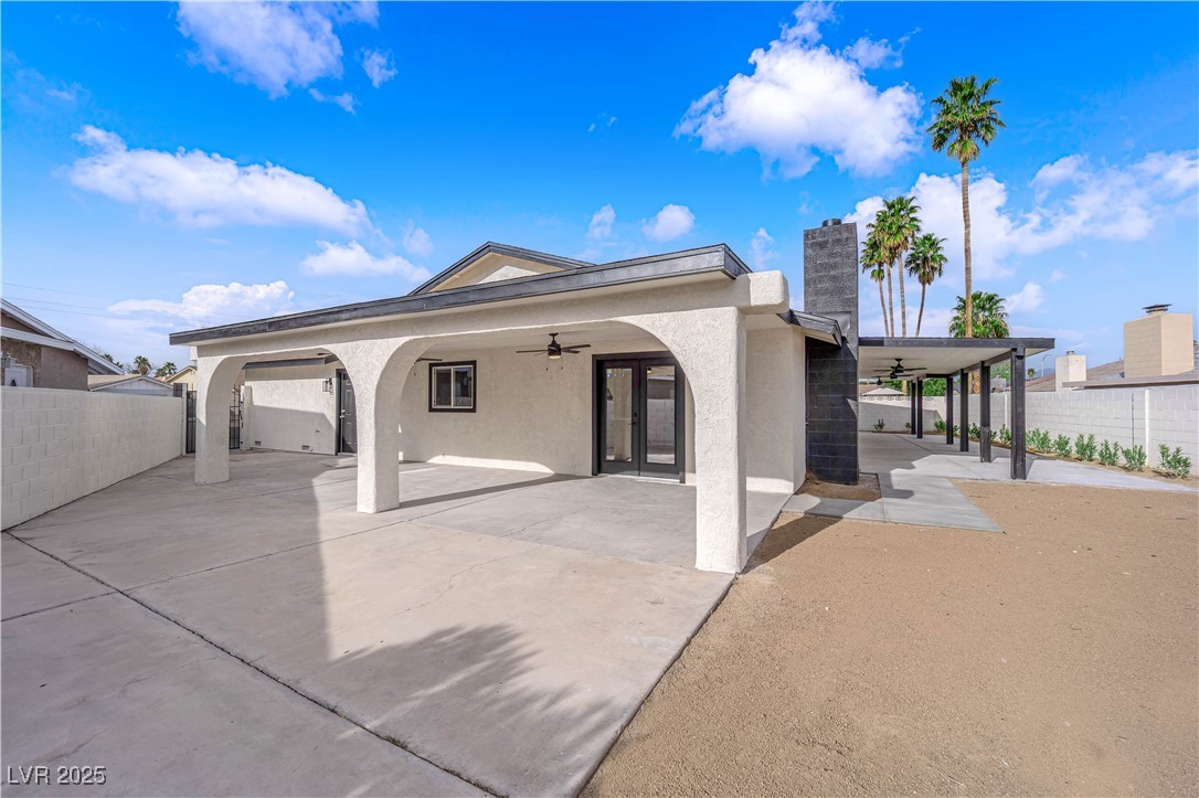 3228 Robin Circle Las Vegas, NV 89121 - Photo 43 of 45 Rear view of house with stucco siding, french door
