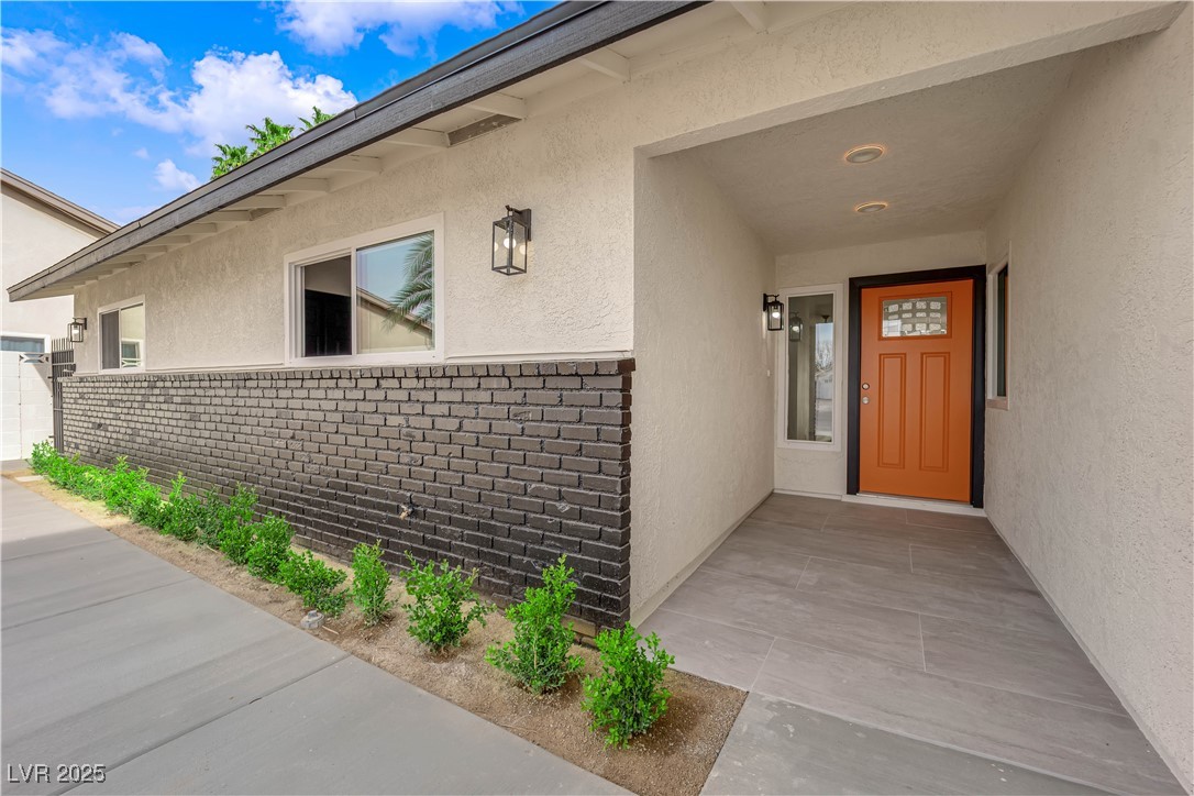 3228 Robin Circle Las Vegas, NV 89121 - Photo 5 of 45 Property entrance featuring brick siding and stucc