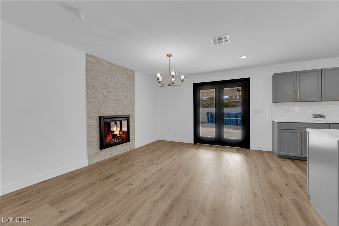 3228 Robin Circle Las Vegas, NV 89121 - Photo 9 of 45 Unfurnished living room with a notable chandelier,