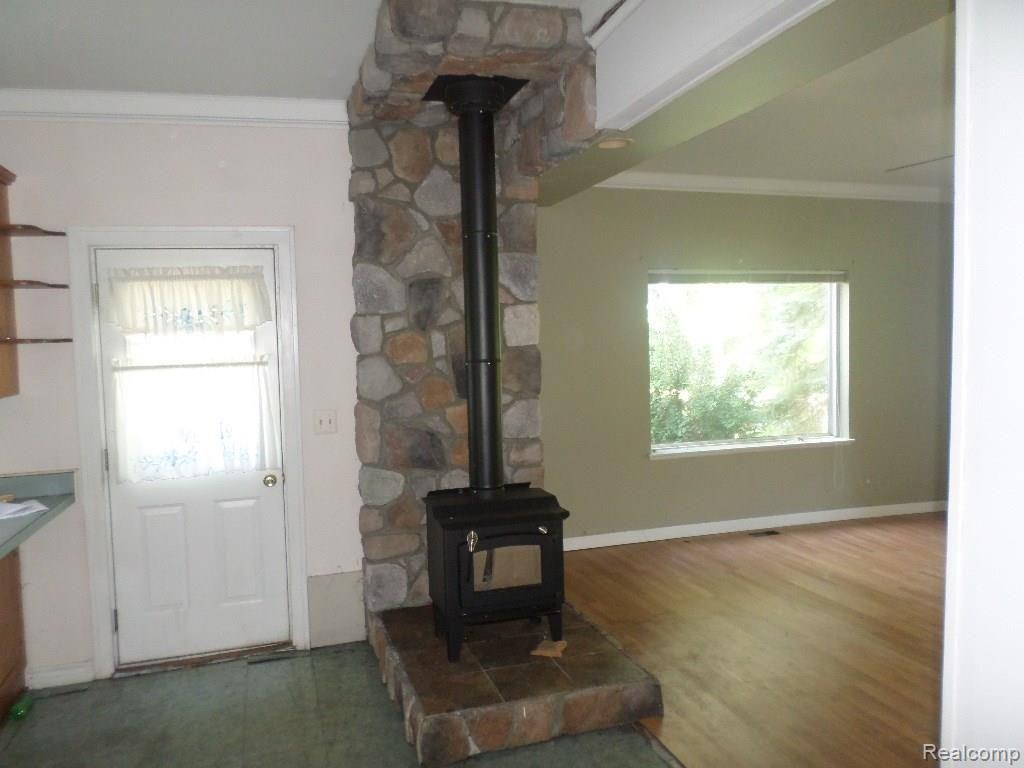 3366 Peppermill Road Attica, MI 48412 - Photo 4 of 32 wood burning stove.JPG