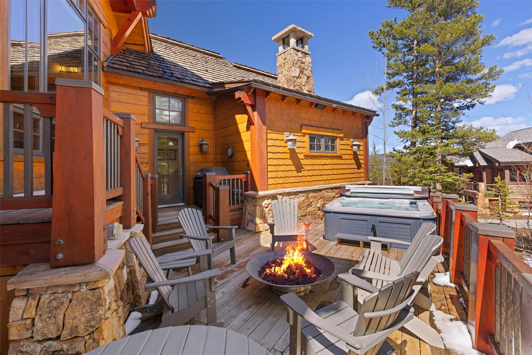317 Timbertrail Road Breckenridge, CO 80424 - Photo 49 of 50 a view of a patio with table and chairs with barbeque grill and plants