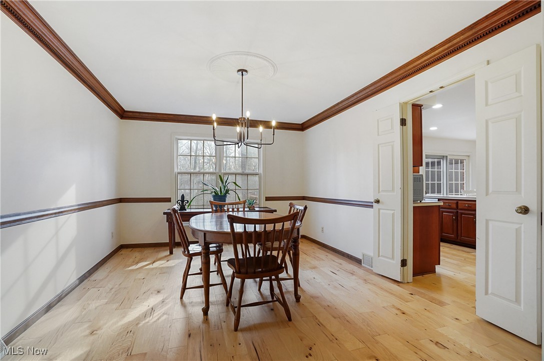 2910 Oxbow Road Richfield, OH 44286 - Photo 8 of 46 new wood floors and chandelier