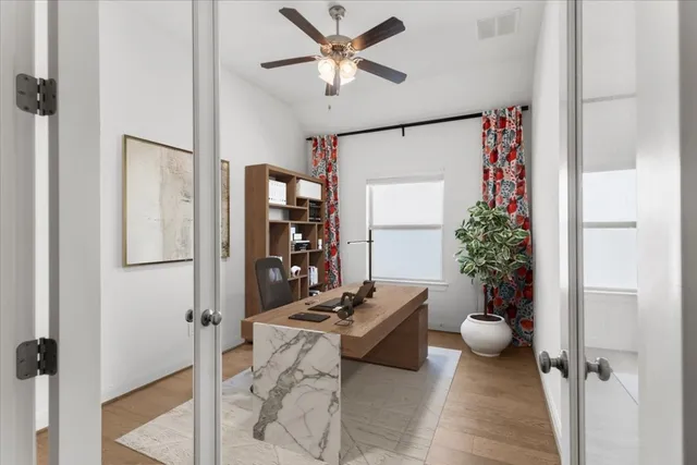 a room with furniture and a potted plant