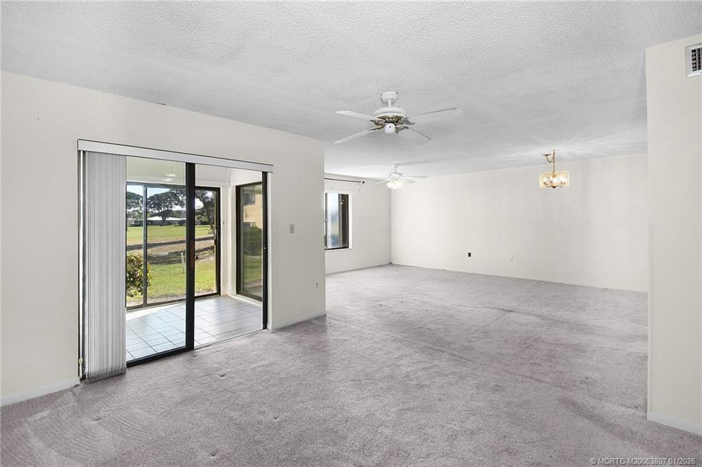 5303 Southeast Miles Grant Road, Unit L101 Stuart, FL 34997 - Photo 18 of 54 an empty room with windows and closet