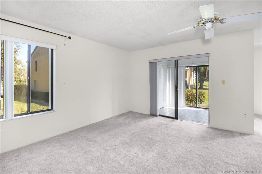 5303 Southeast Miles Grant Road, Unit L101 Stuart, FL 34997 - Photo 19 of 54 a view of an empty room with a window