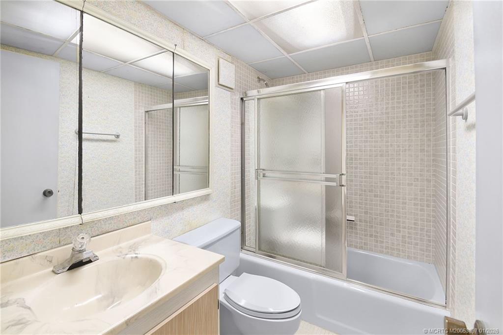 5303 Southeast Miles Grant Road, Unit L101 Stuart, FL 34997 - Photo 21 of 54 a bathroom with a sink toilet and shower