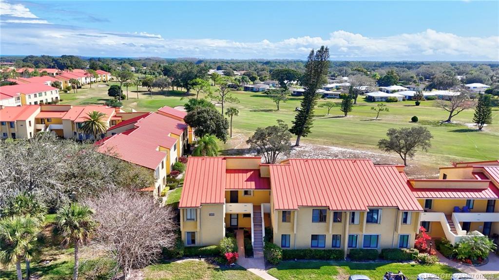 5303 Southeast Miles Grant Road, Unit L101 Stuart, FL 34997 - Photo 27 of 54 a view of a city with lawn chairs