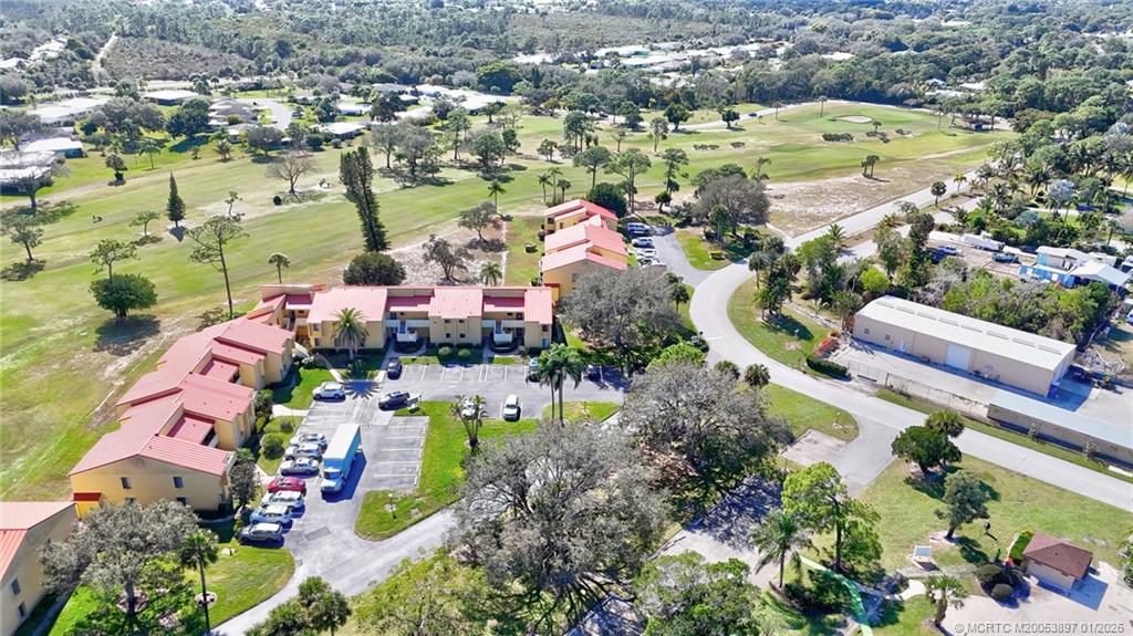 5303 Southeast Miles Grant Road, Unit L101 Stuart, FL 34997 - Photo 34 of 54 an aerial view of residential houses with outdoor space