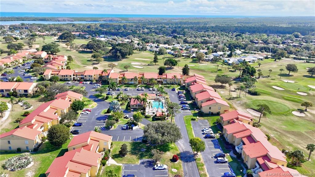 5303 Southeast Miles Grant Road, Unit L101 Stuart, FL 34997 - Photo 36 of 54 an aerial view of residential houses with outdoor space