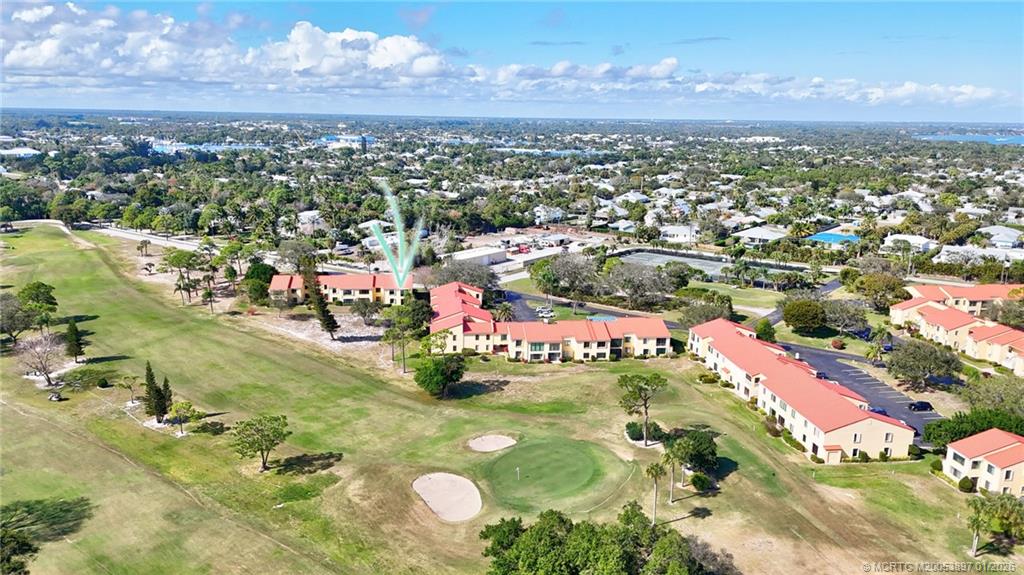 5303 Southeast Miles Grant Road, Unit L101 Stuart, FL 34997 - Photo 38 of 54 an aerial view of residential houses with outdoor space