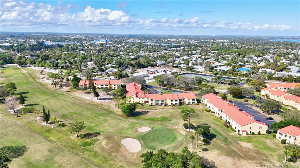 5303 Southeast Miles Grant Road, Unit L101 Stuart, FL 34997 - Photo 39 of 54 an aerial view of residential houses with outdoor space