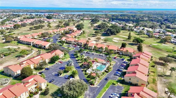 an aerial view of residential building and ocean