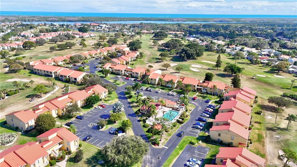5303 Southeast Miles Grant Road, Unit L101 Stuart, FL 34997 - Photo 41 of 54 an aerial view of residential houses with outdoor space