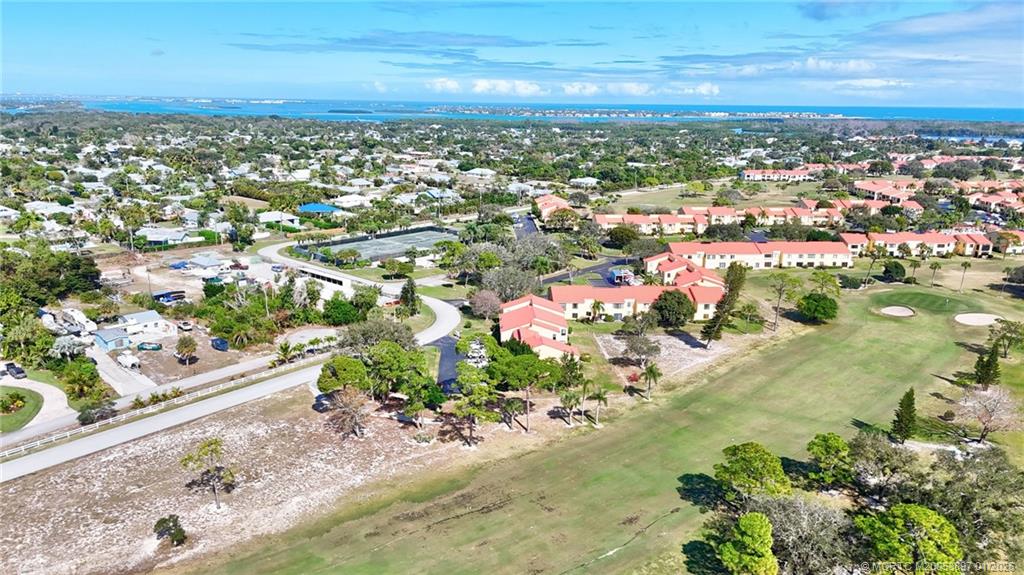 5303 Southeast Miles Grant Road, Unit L101 Stuart, FL 34997 - Photo 44 of 54 an aerial view of residential houses with outdoor space