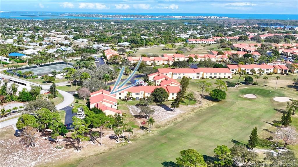 5303 Southeast Miles Grant Road, Unit L101 Stuart, FL 34997 - Photo 47 of 54 an aerial view of multiple house