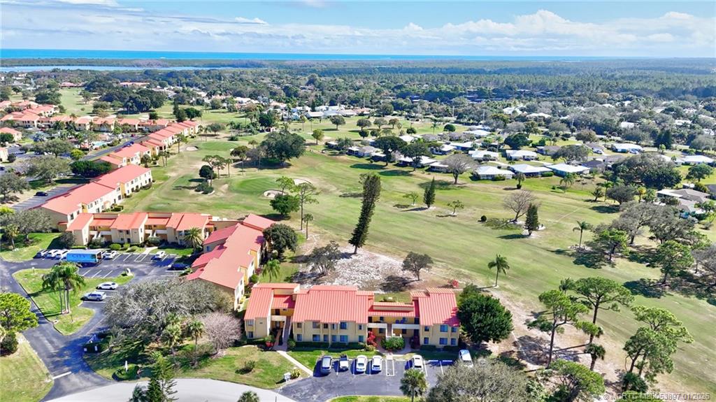 5303 Southeast Miles Grant Road, Unit L101 Stuart, FL 34997 - Photo 50 of 54 an aerial view of residential houses with outdoor space