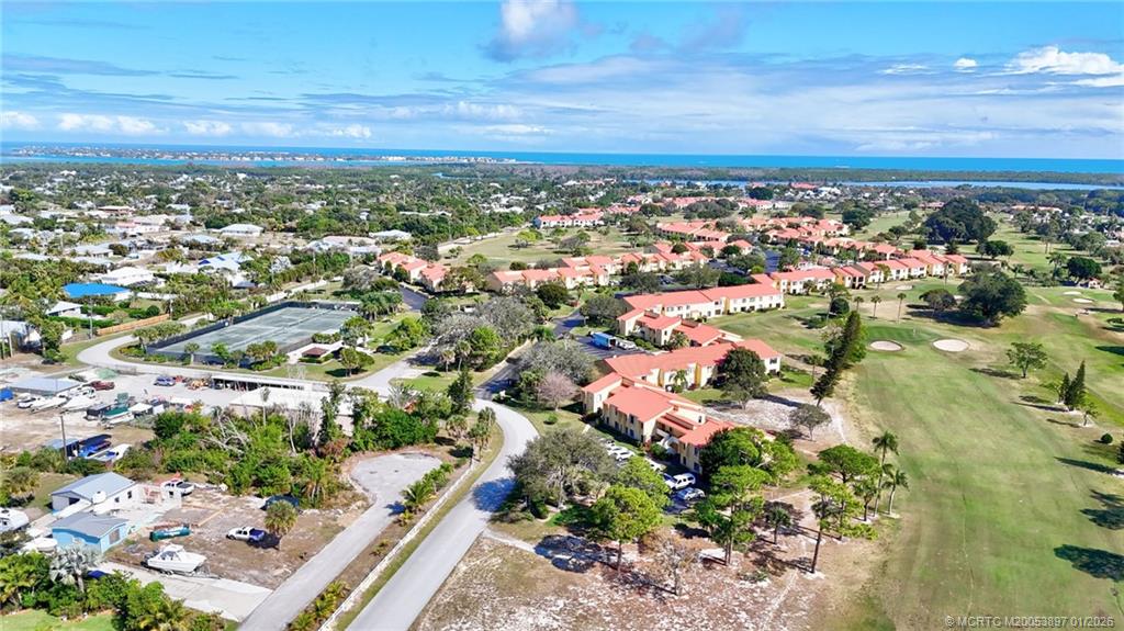 5303 Southeast Miles Grant Road, Unit L101 Stuart, FL 34997 - Photo 51 of 54 an aerial view of residential building and city