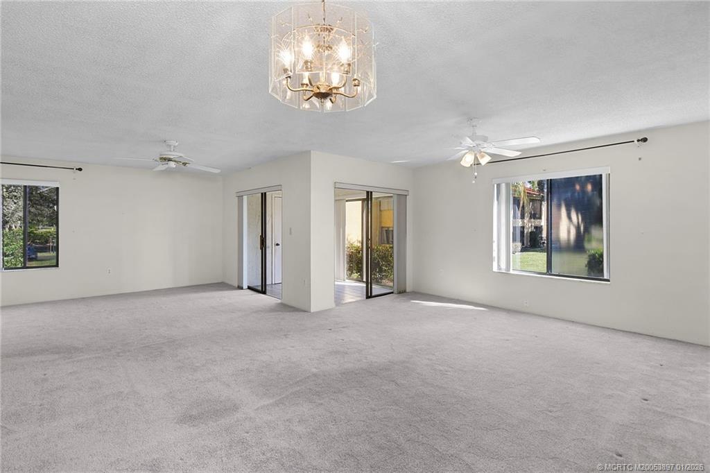 5303 Southeast Miles Grant Road, Unit L101 Stuart, FL 34997 - Photo 8 of 54 a view of an empty room with a window