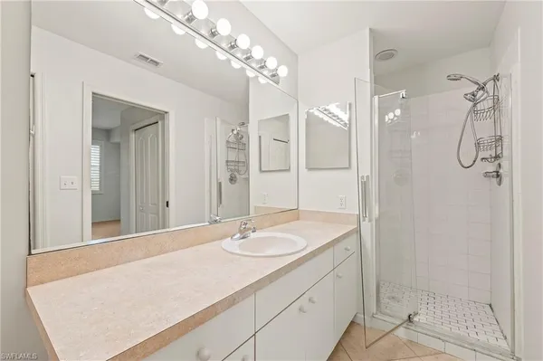 a bathroom with sink and mirror