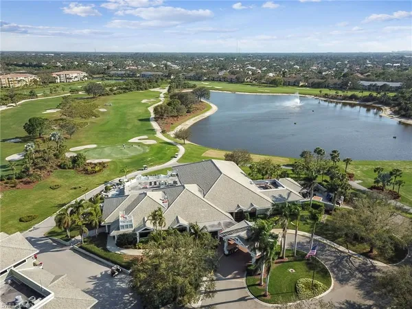 an aerial view of a house with swimming pool garden and mountain view