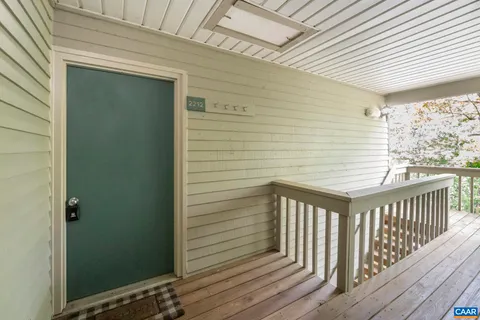 a front view of a house with a yard and tree s