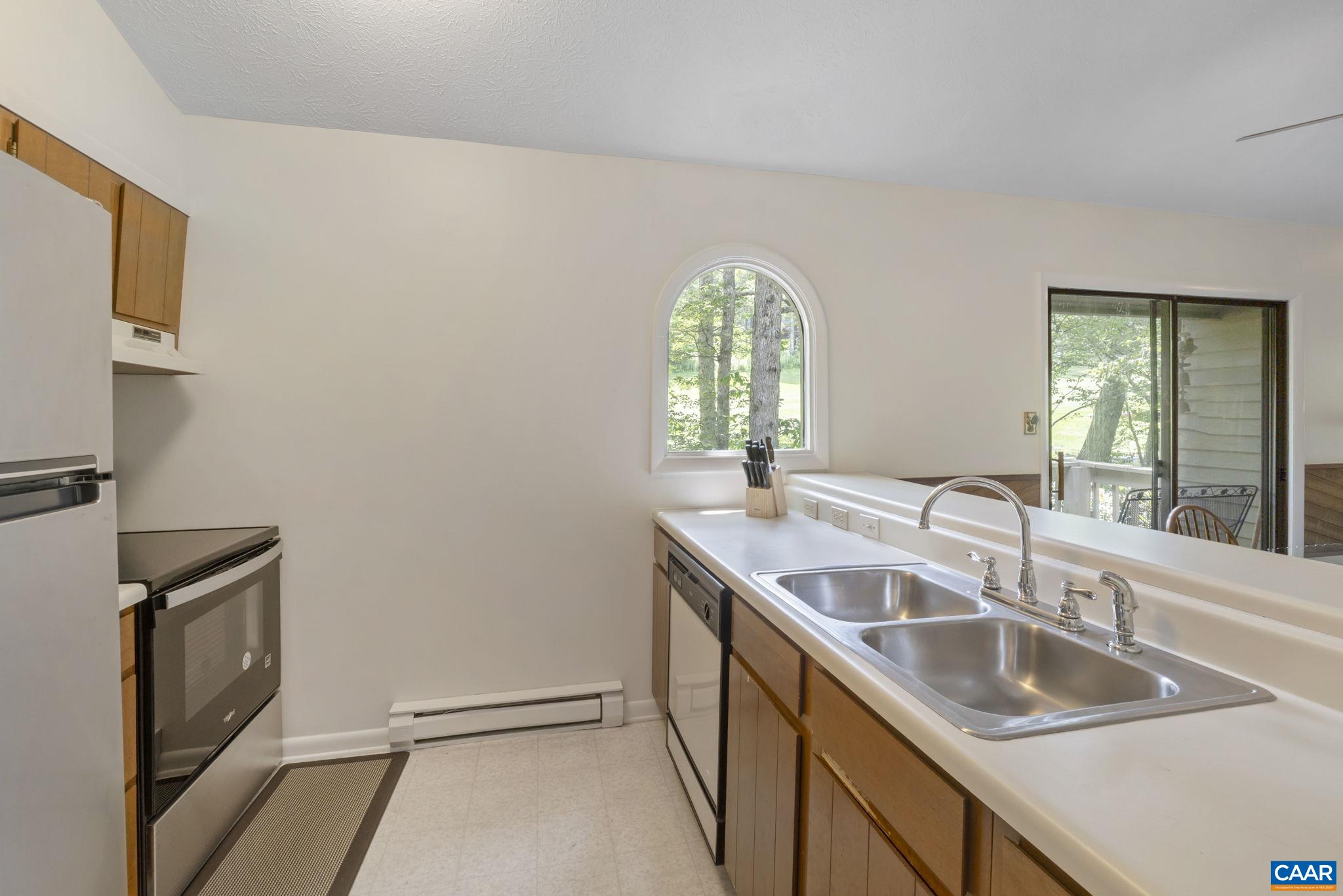 2212 Tanners Ridge Roseland, VA 22967 - Photo 6 of 32 a bathroom with a granite countertop sink a mirror and a window
