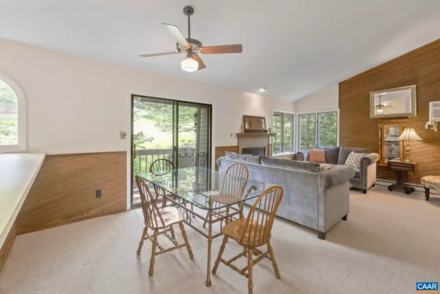 a dining room with furniture and window