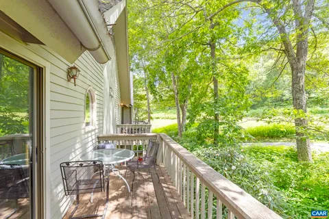 a view of balcony with furniture