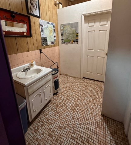977 Highway 25W Newport, TN 37821 - Photo 14 of 35 a utility room with a sink a vanity and a mirror
