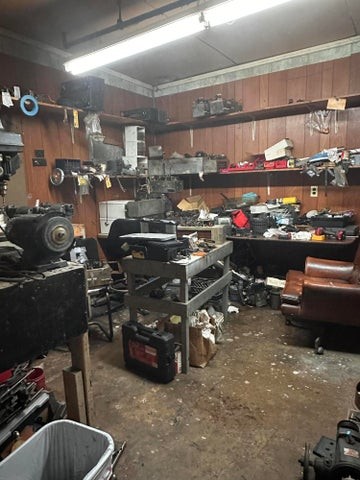 977 Highway 25W Newport, TN 37821 - Photo 34 of 35 a room with gym equipment and lots of wooden cabinets