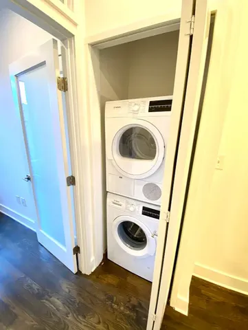 a view of entrance door with wooden floor