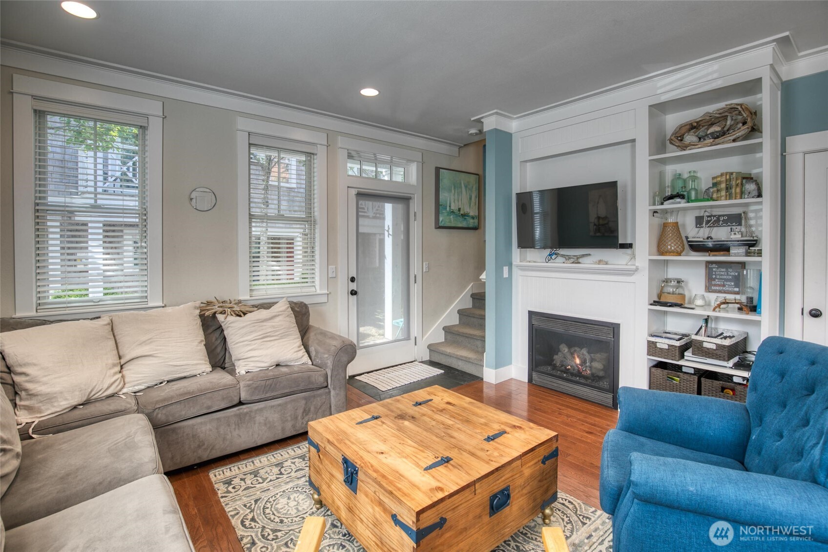 38 West Myrtle Lane Pacific Beach, WA 98571 - Photo 12 of 31 a living room with furniture a flat screen tv and a fireplace