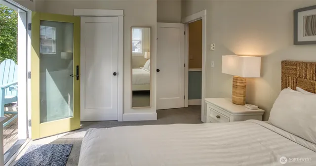 a bedroom with a bed and a lamp