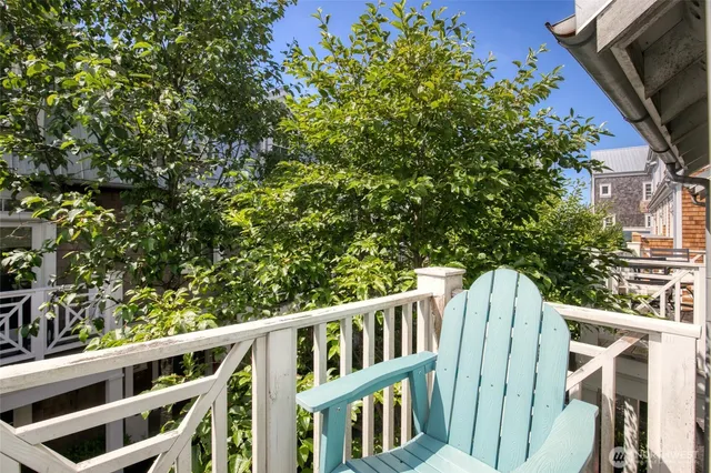 a view of outdoor space with deck and wooden fence