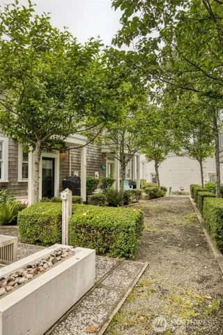 a front view of a house with garden