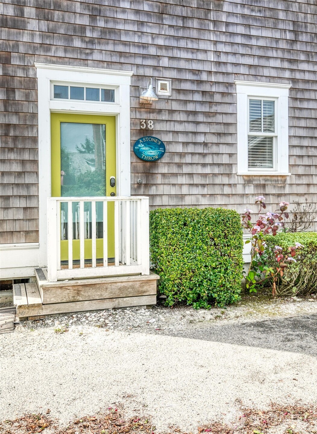 38 West Myrtle Lane Pacific Beach, WA 98571 - Photo 29 of 31 a front view of a house with a yard and potted plants