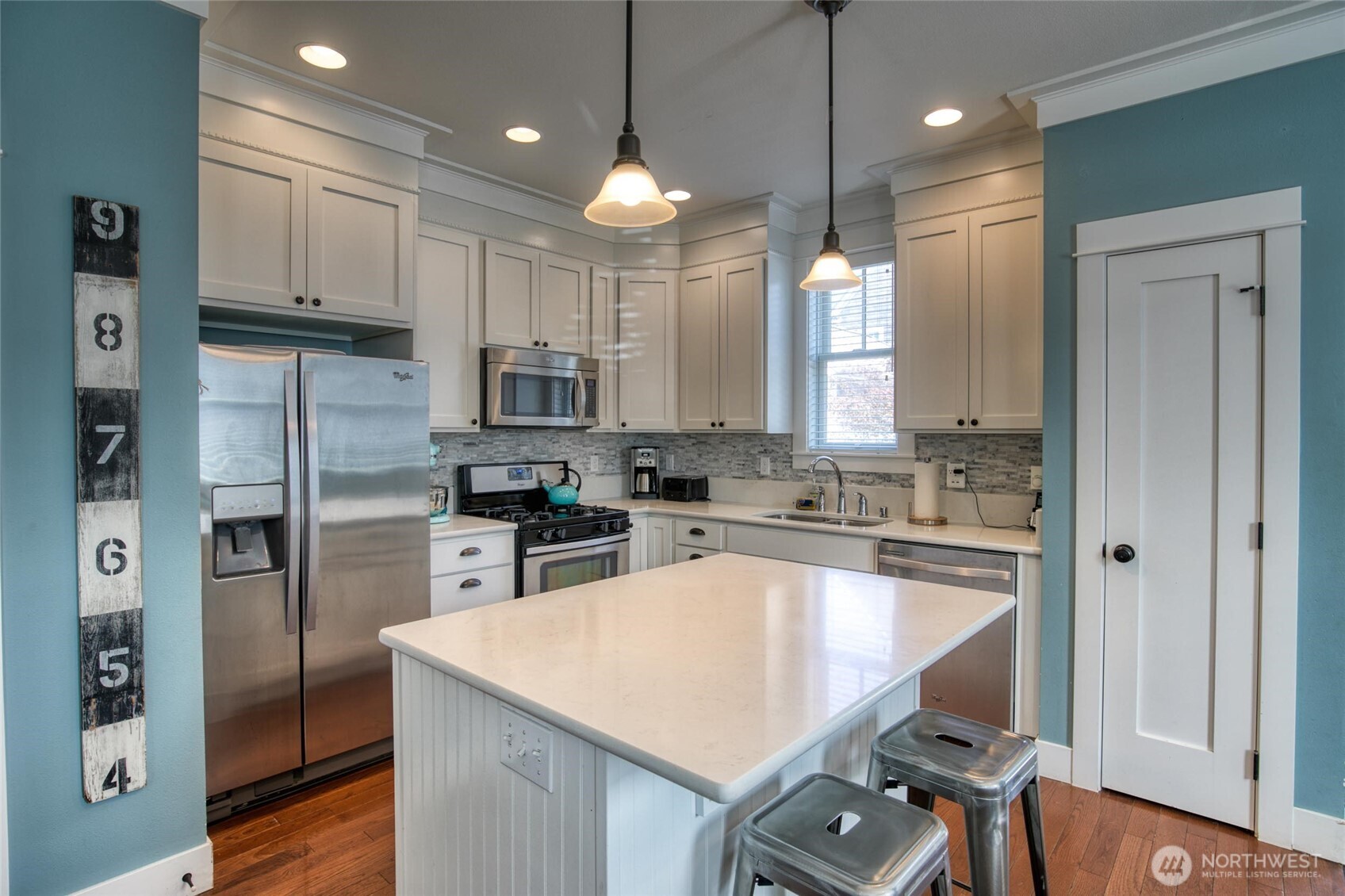 38 West Myrtle Lane Pacific Beach, WA 98571 - Photo 7 of 31 a kitchen with kitchen island a large counter top space appliances and cabinets