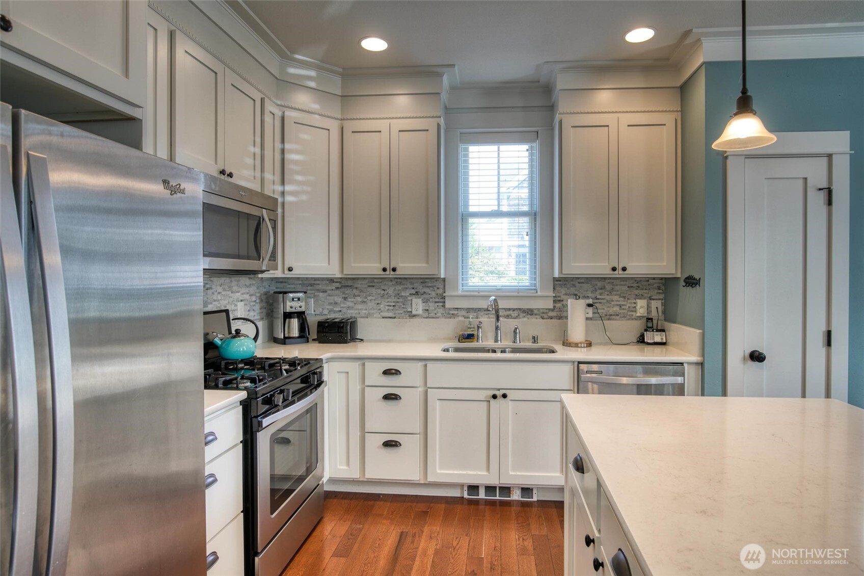 38 West Myrtle Lane Pacific Beach, WA 98571 - Photo 8 of 31 a kitchen with stainless steel appliances a refrigerator sink and cabinets