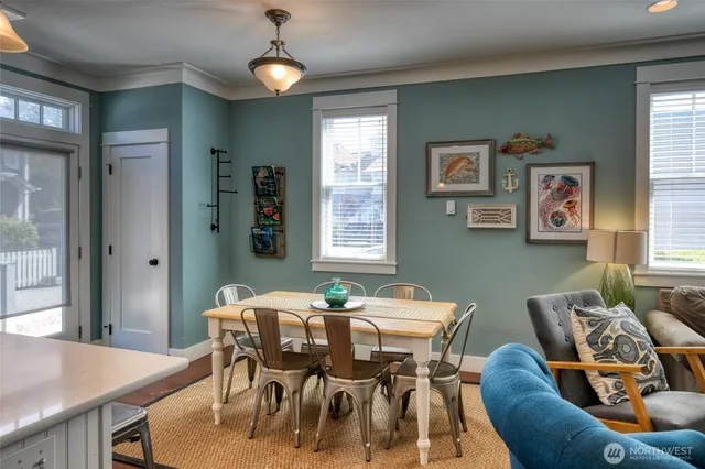 a dining room with furniture and window