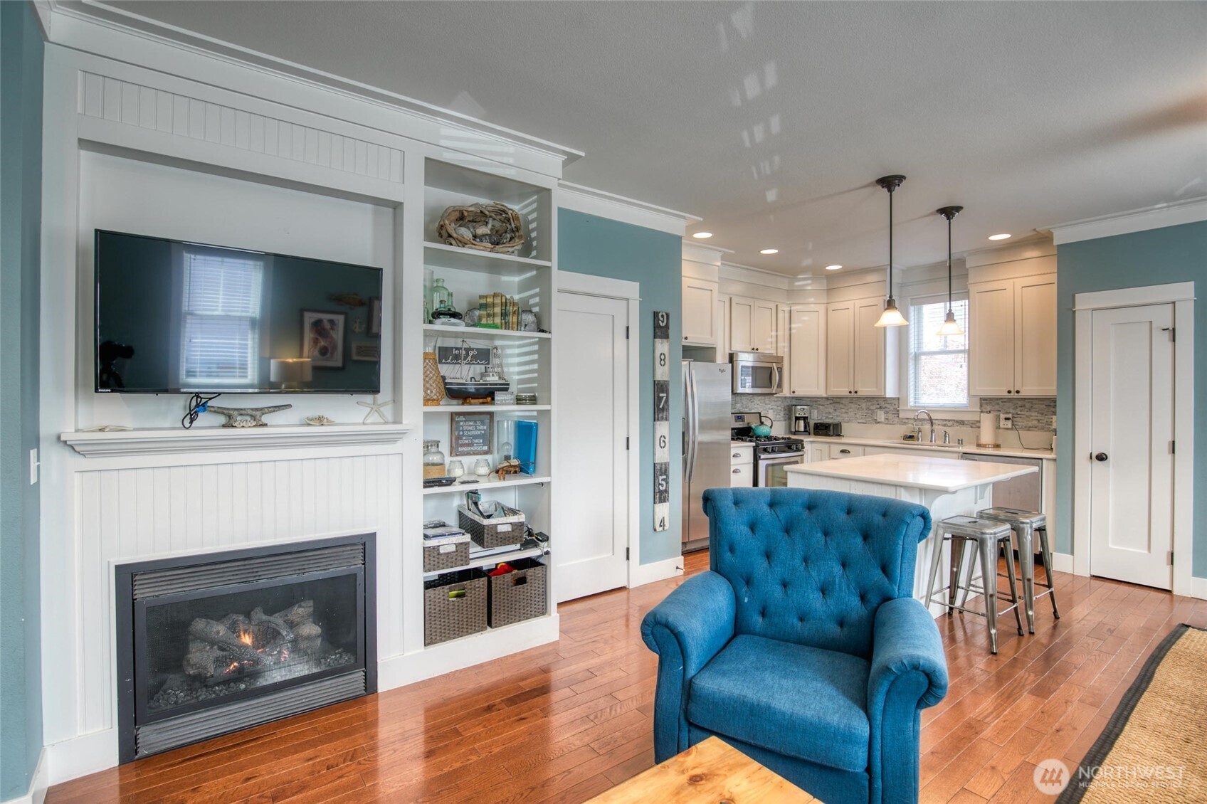 38 West Myrtle Lane Pacific Beach, WA 98571 - Photo 10 of 31 a living room with furniture a flat screen tv and a fireplace