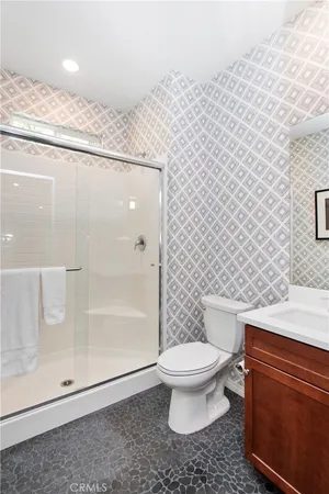 a bedroom with bed and a window