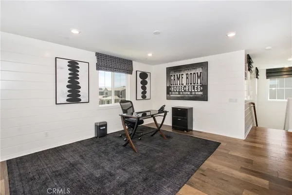 a workspace with furniture and a window