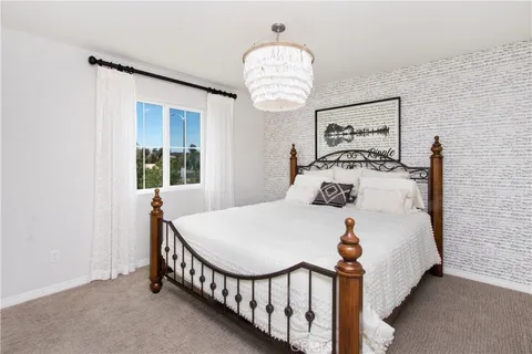 a bathroom with a double vanity sink a mirror and a shower