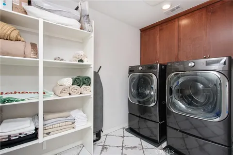 a spacious bathroom with a granite countertop sink mirror and a