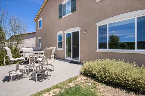 a view of a lake with a house in the background