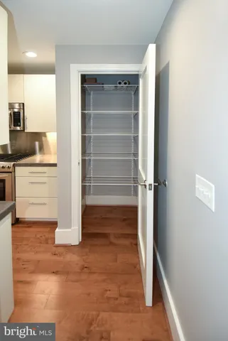 a kitchen with stainless steel appliances granite countertop a sink and a stove
